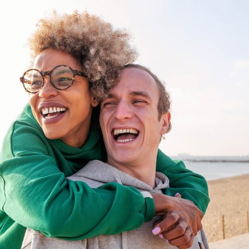 happy-young-couple-hugging-and-laughing-2022-11-07-23-32-47-utc